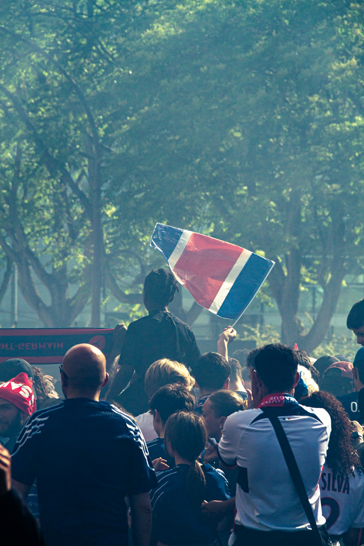 Football fans celebrating with Canadian flags